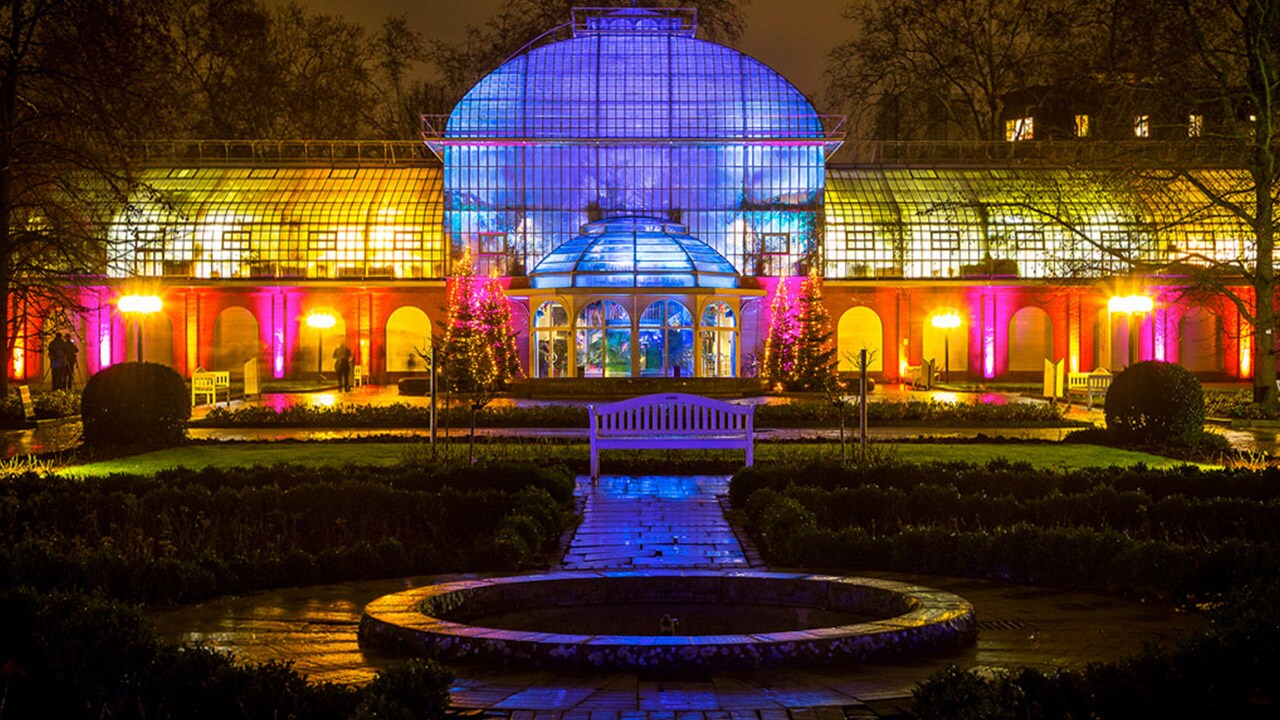 The Palmengarten, Frankfurt lit up at night. A view of the Botanical gardens